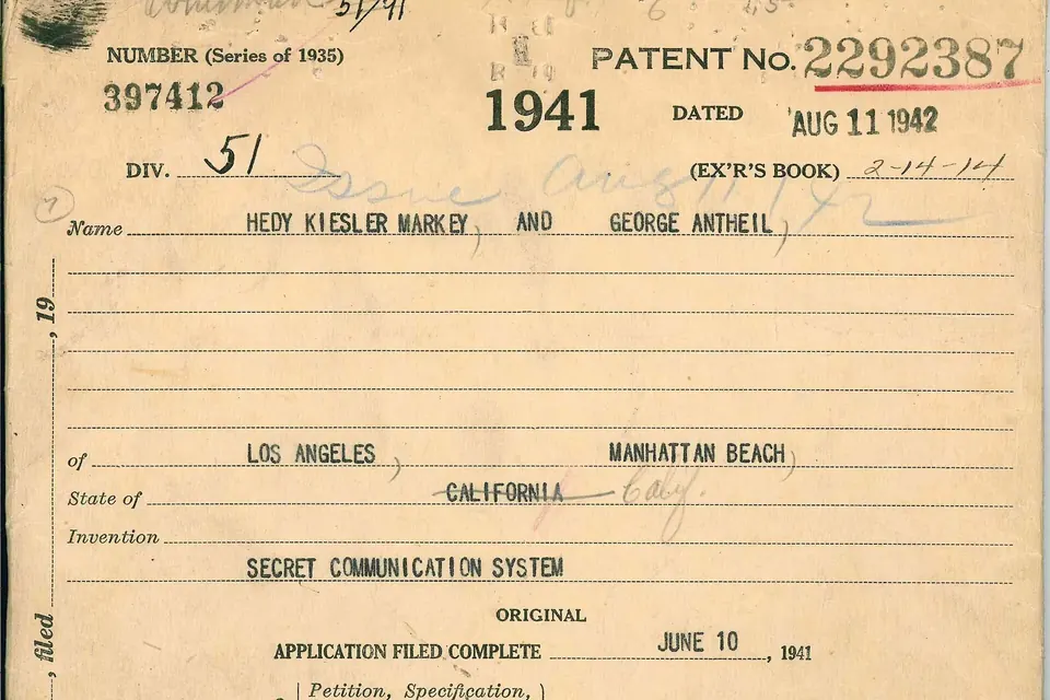 A yellowed patent office file card for US patent 2,292,387, dated 1942, listing two inventors and the title Secret Communication System